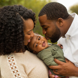 Happy family. Mother father and baby girl.