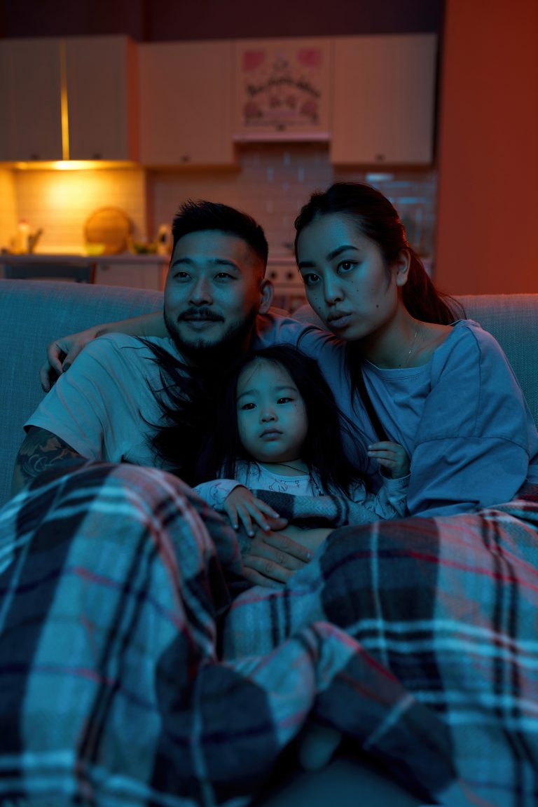 Asian family watching TV