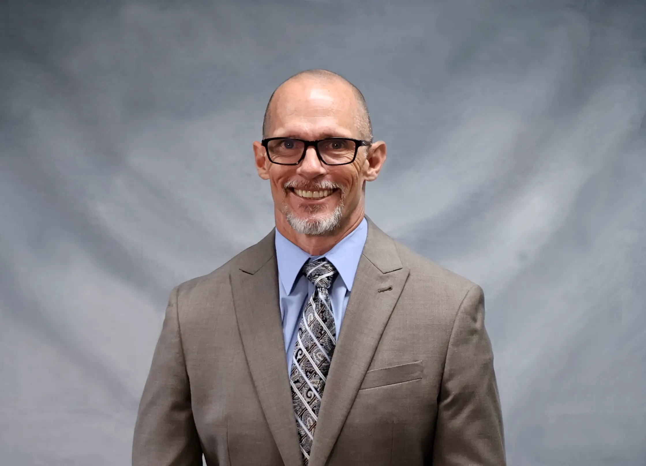 Headshot for President and CEO Mike Duggar